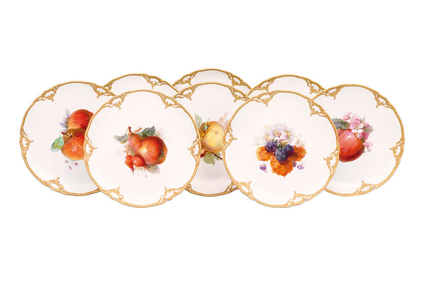 A set of 8 fruit plates with rocaille decoration