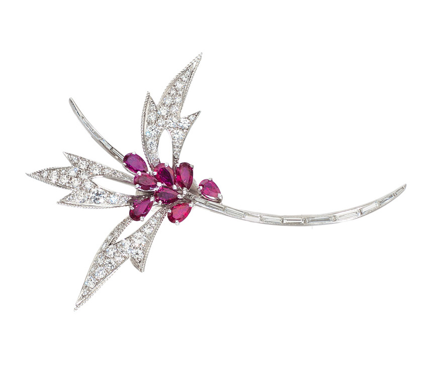 A flower brooch with fine rubies and diamonds