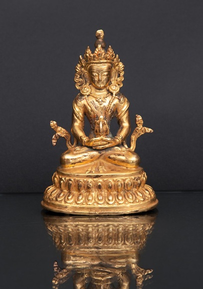 A miniature figure of a seated 'Amithaba'