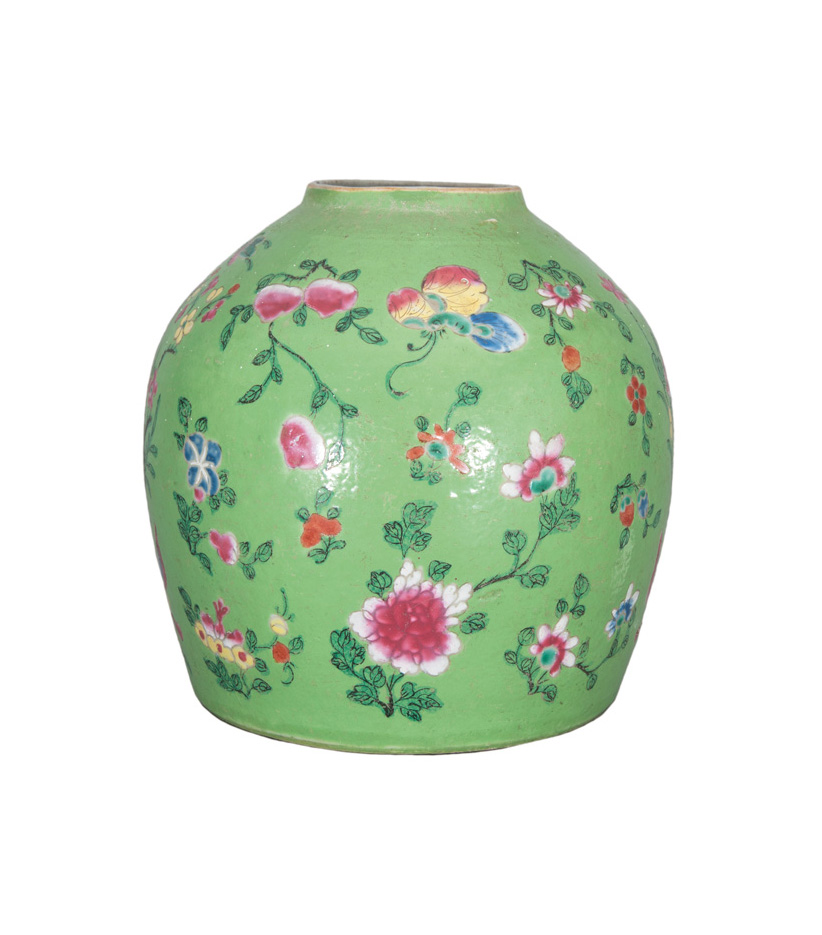 An apple-green ginger jar with flower decoration and butterflies