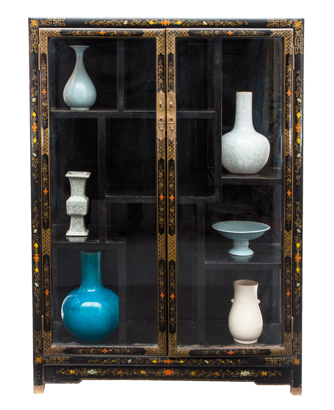 A black lacquered display cabinet
