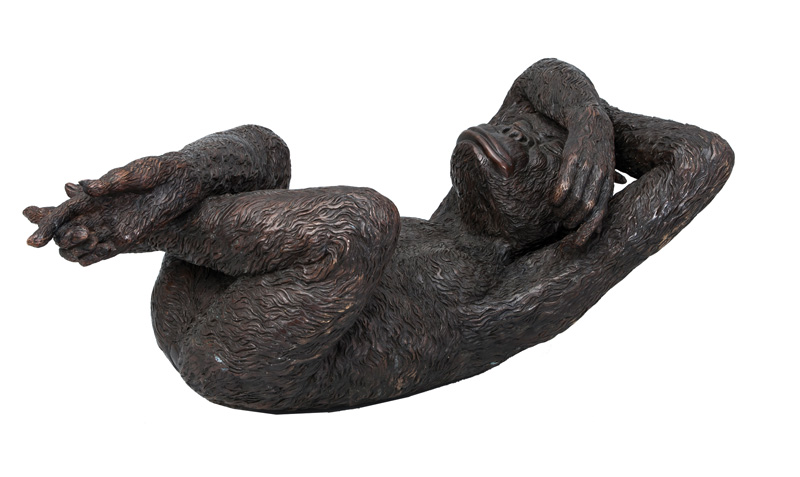 A large bronze figure 'Lying monkey'