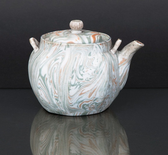 An unusual marbled pottery teapot