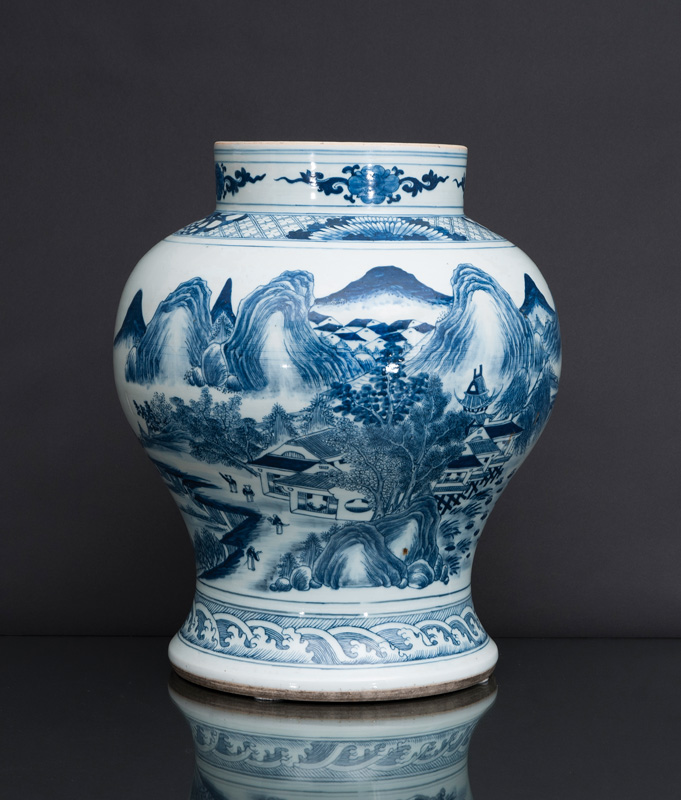 A tall articulated baluster vase with landscape scene