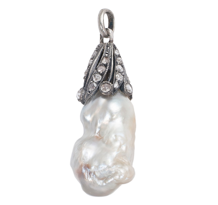 A natural pearl pendant with diamonds