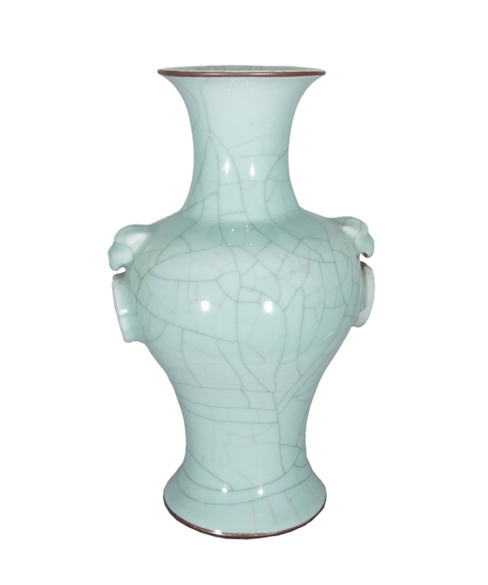 A celadon baluster vase with lion handles.