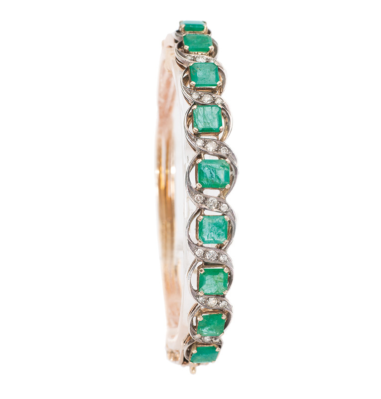 An antique emerald diamond bangle bracelet