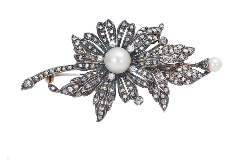 An antique diamond pearl brooch