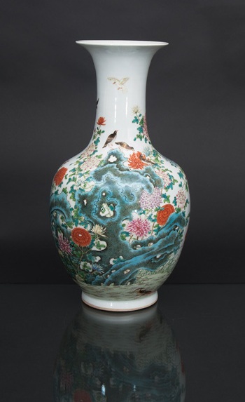A fine baluster vase with birds on rocks