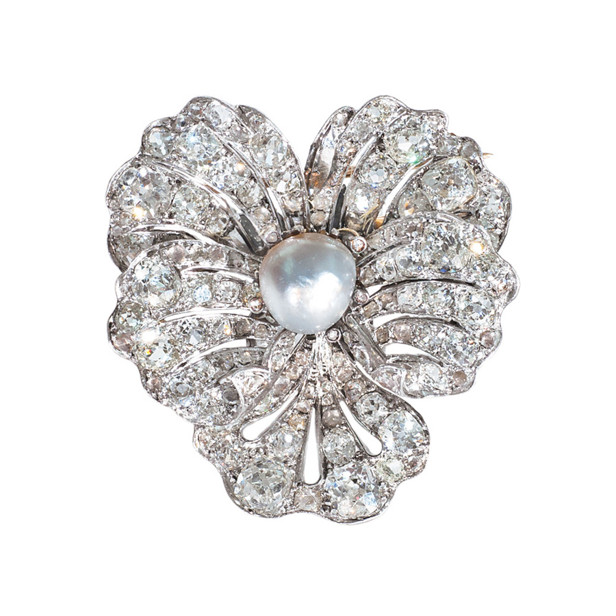 A highcarat antique diamond brooch with natural pearl