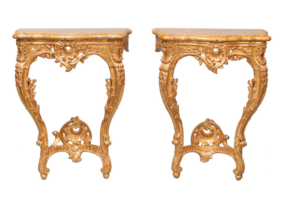 A pair of gilded console tables with of Rococo style
