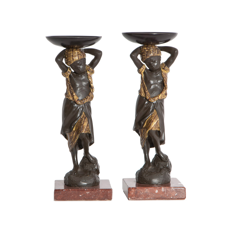 A pair of bronze figures 'Blackamoor with large bowl'