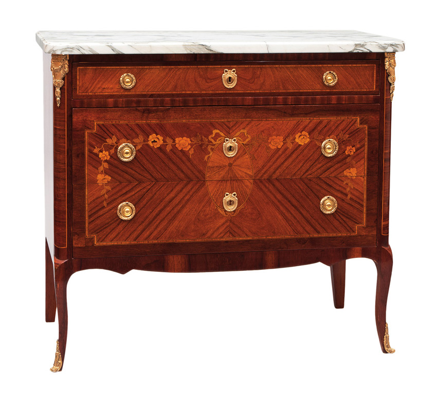 An elegant chest of drawers with floral marquetry