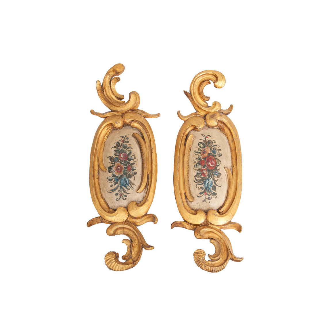 A pair of floral wall decorations with rocaille frame