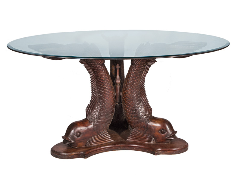 An interesting table with dolphin feet