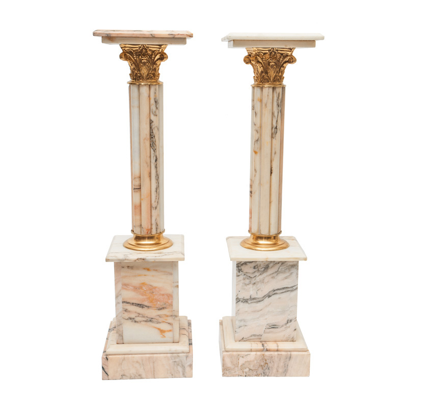 A pair of decorative marble columns