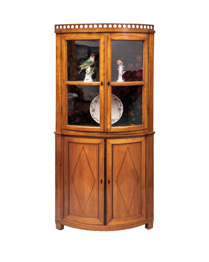 A Biedermeier corner glass cabinet