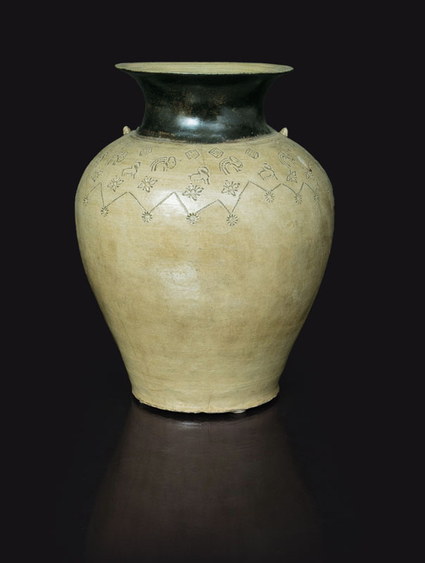 A tall storage jar with animal decoration