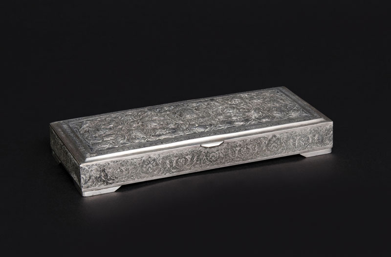 A silver box with floral decoration