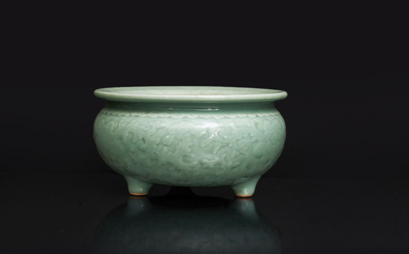 A large celadon tripod censer