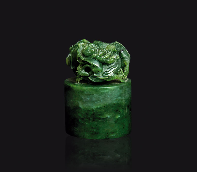 A spinach-green jade seal with dragon and pearl