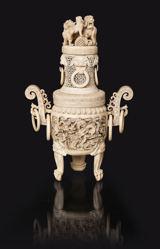 A tall ivory incense burner