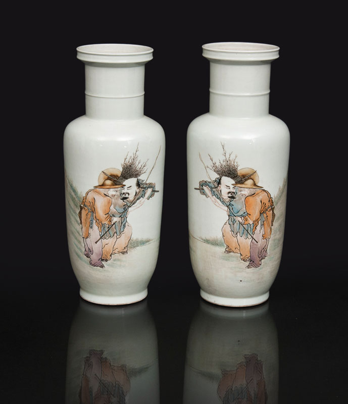 A pair of rouleau vases with genre scene