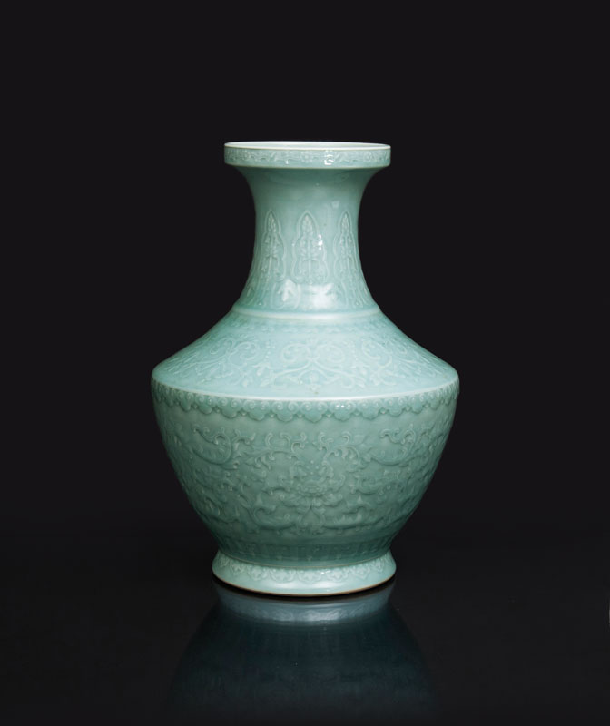 A large celadon vase with fine floral relief