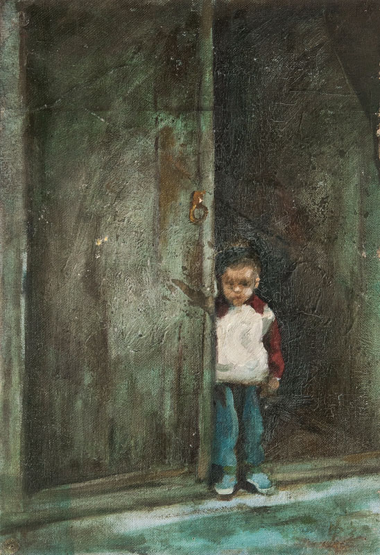 Boy in front of a gate