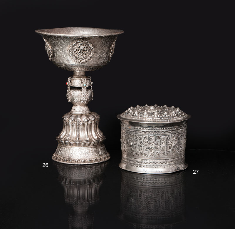 A silver yak butter lamp