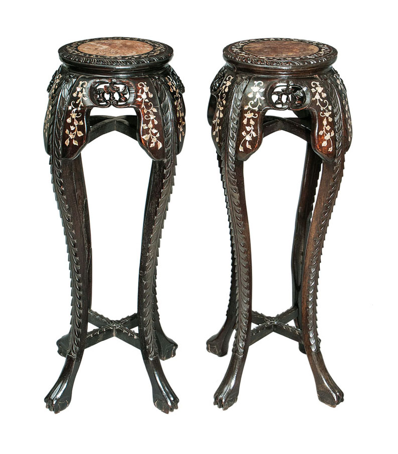 A pair of tall 'mother-of-pearl' urn stands