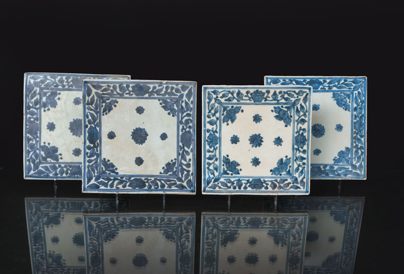 A set of 4 tiles with floral decoration