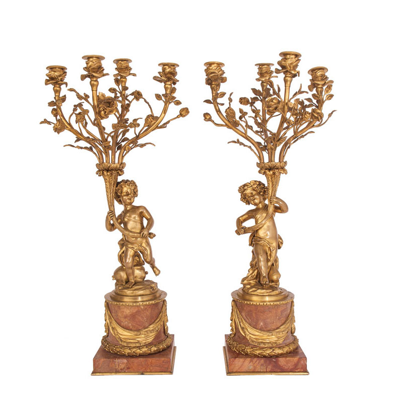 A pair of opulent Napoleon III candelabra