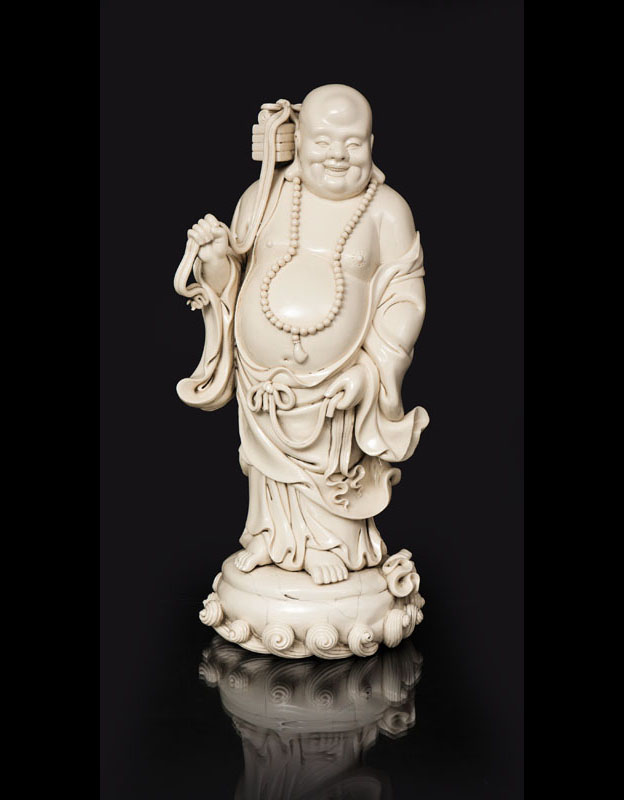 A fine Dehua figure 'Standing Budai'