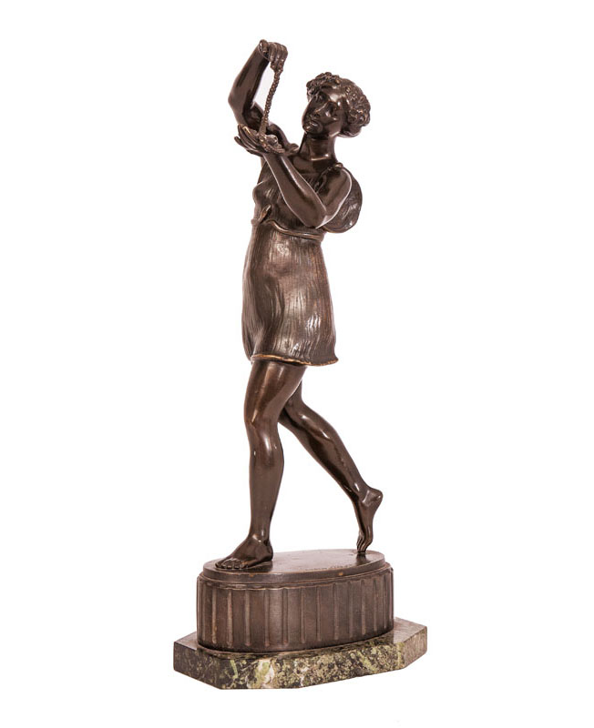 A bronze figure 'Femal dancer with chain'