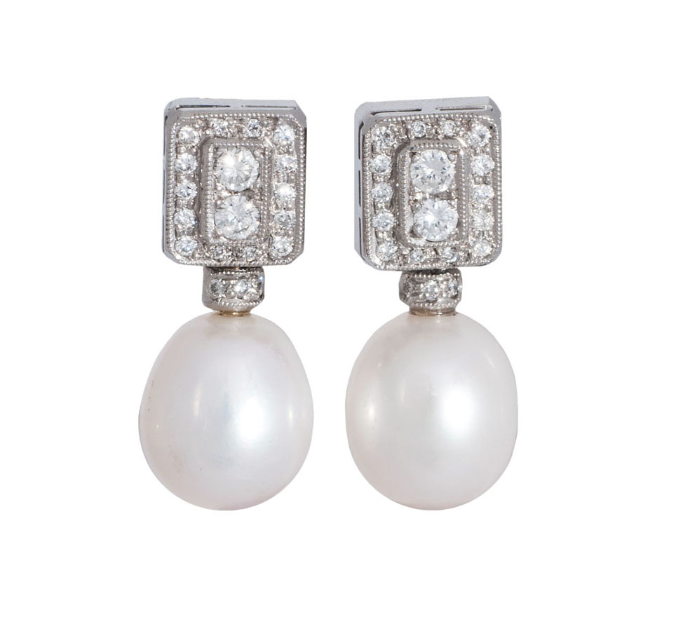 A pair of diamond pearl earrings