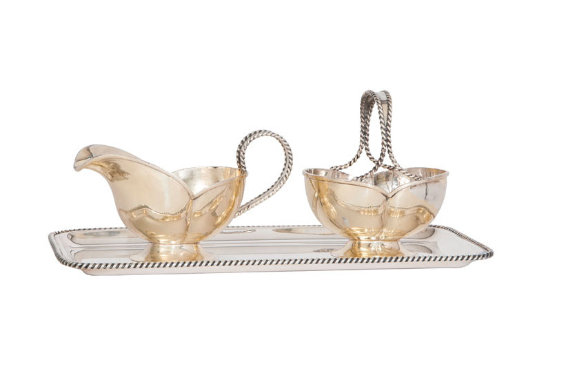 A tray with sugar bowl and creamer