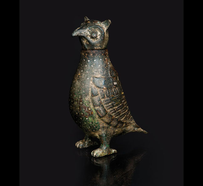A rare and small inlaid bronze vessel in the shape of a bird