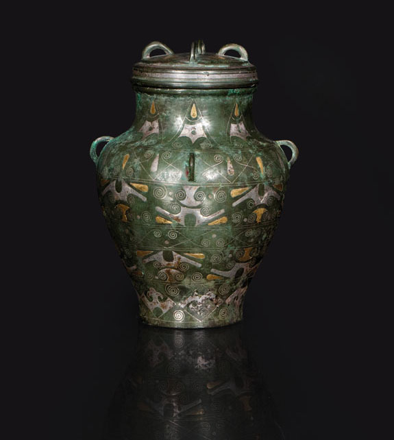 A fine gold and silver inlaid bronze vase with cover