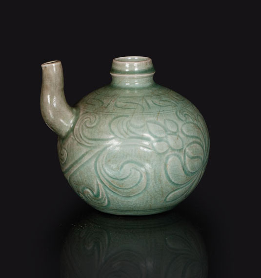 A small bellied celadon ewer with floral decoration