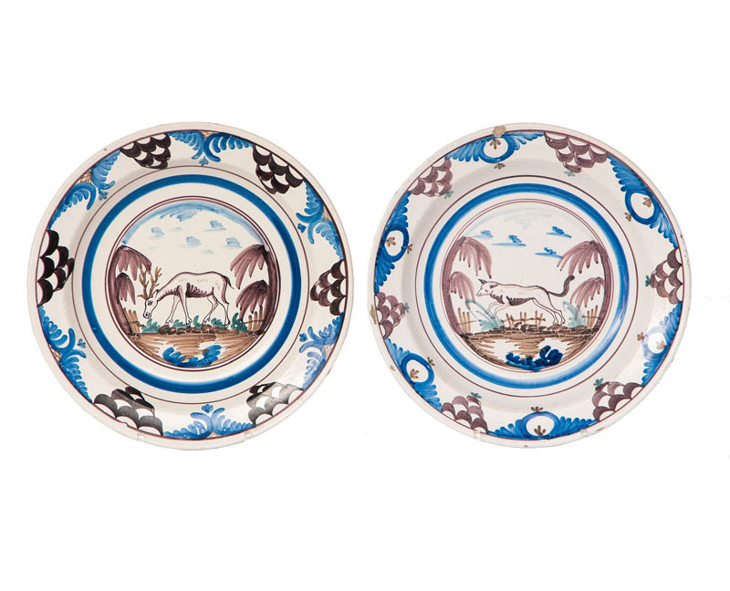 A pair of faience plates with animal painting