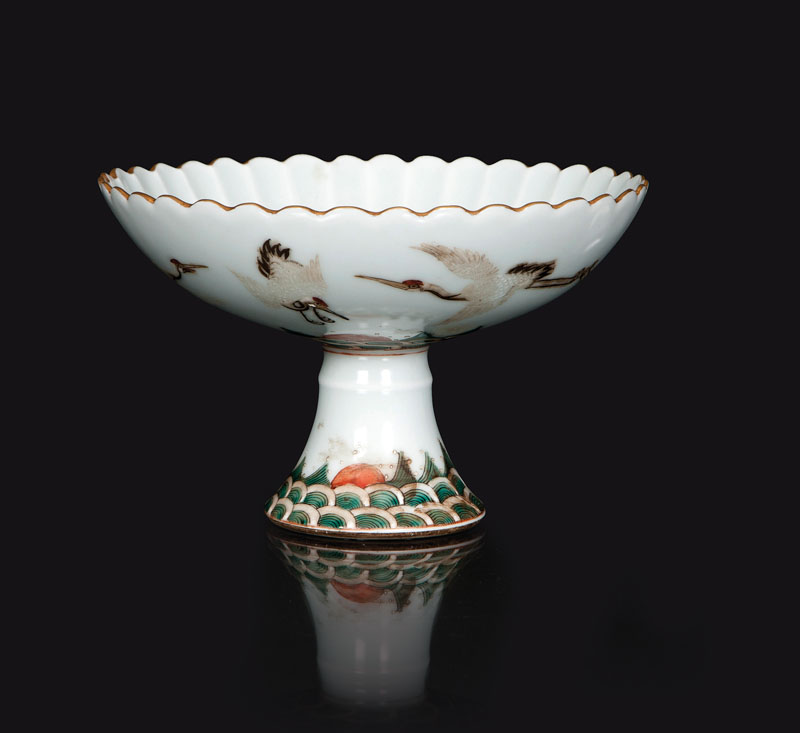 A footed bowl with cranes