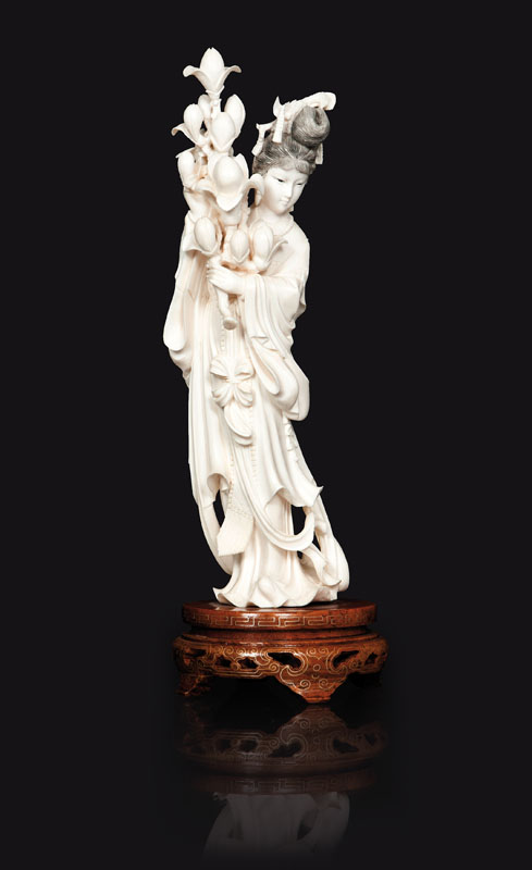 An ivory varving 'Lady with magnolia'