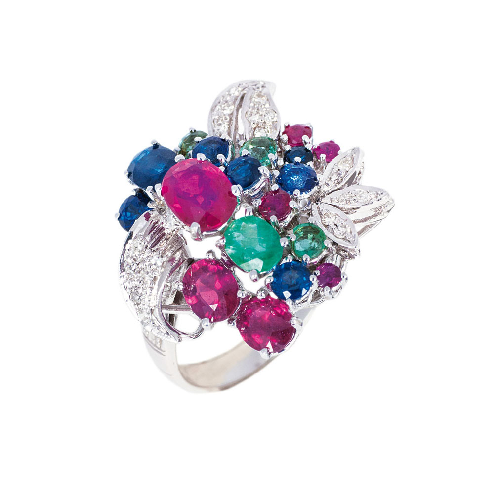 A flowershaped cocktailring with rich setting of rubies, emeralds and sapphires