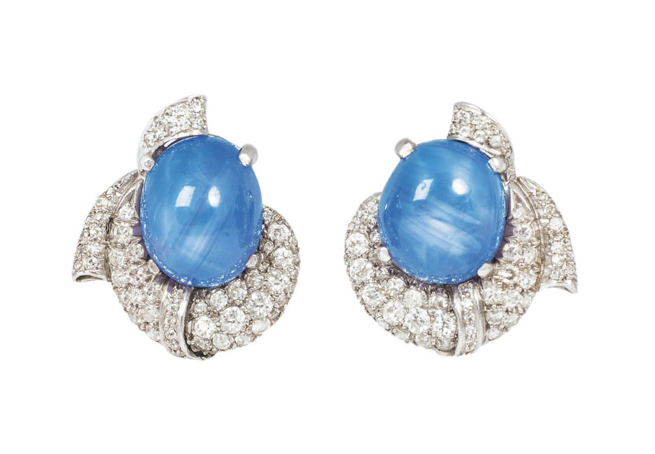 A pair of star-sapphire diamond earrings