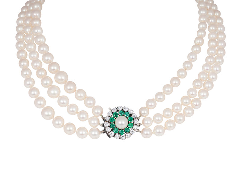 A pearl necklace with emerald diamond clasp