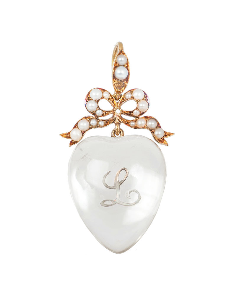 An antique cristall pendant in heartshape with small pearls