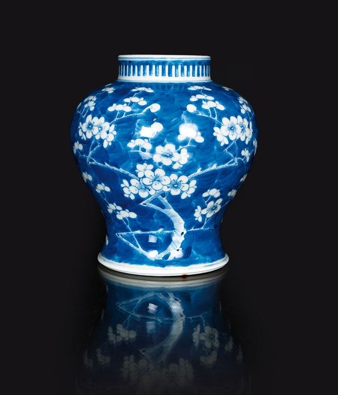 A small baluster vase with flowering plum