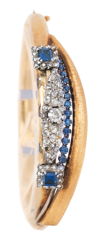 A golden bangle bracelet with diamond and sapphire setting - image 2