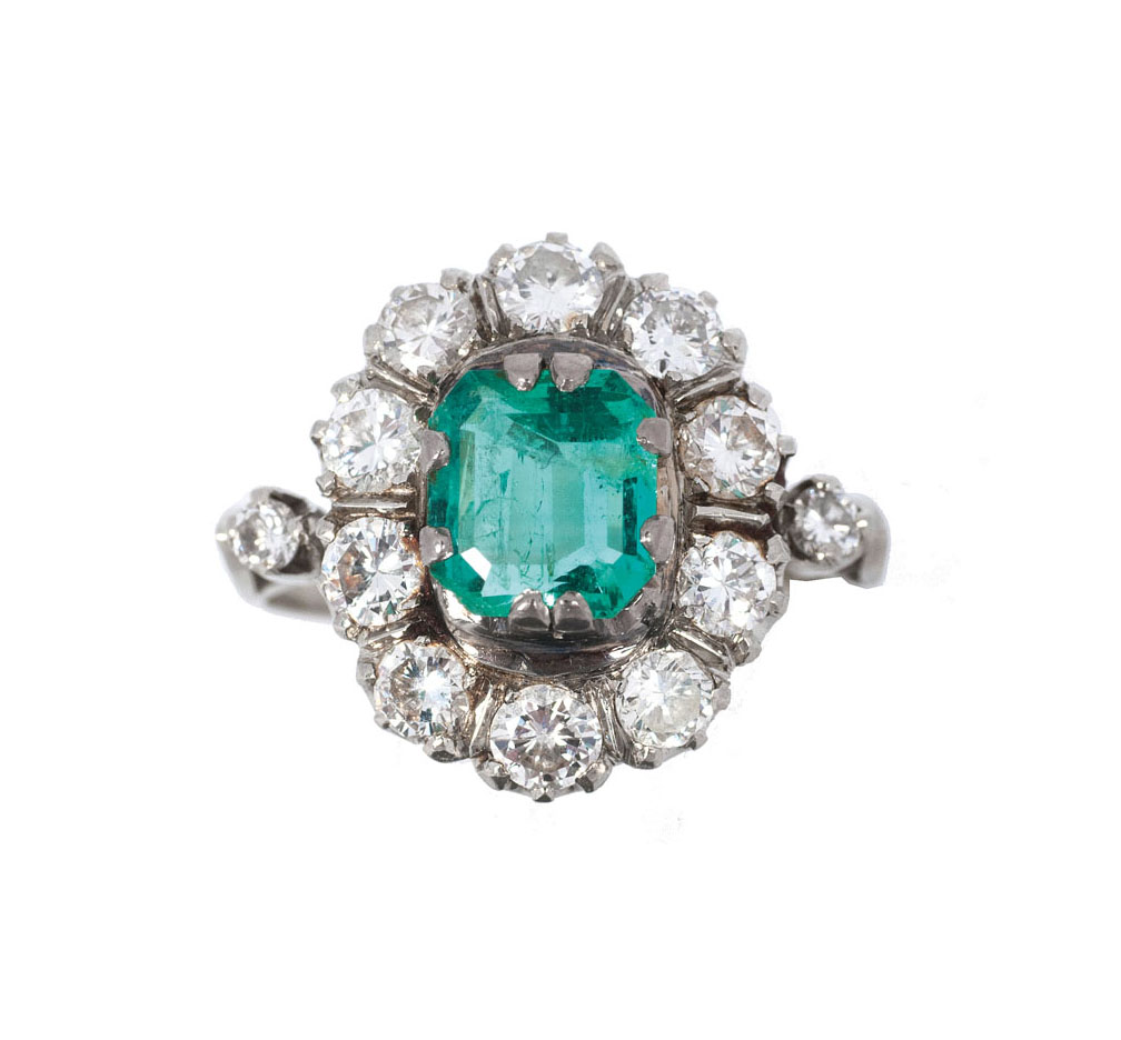 An emerald diamond ring